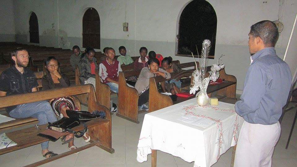 A trainee teacher presenting at graduation.